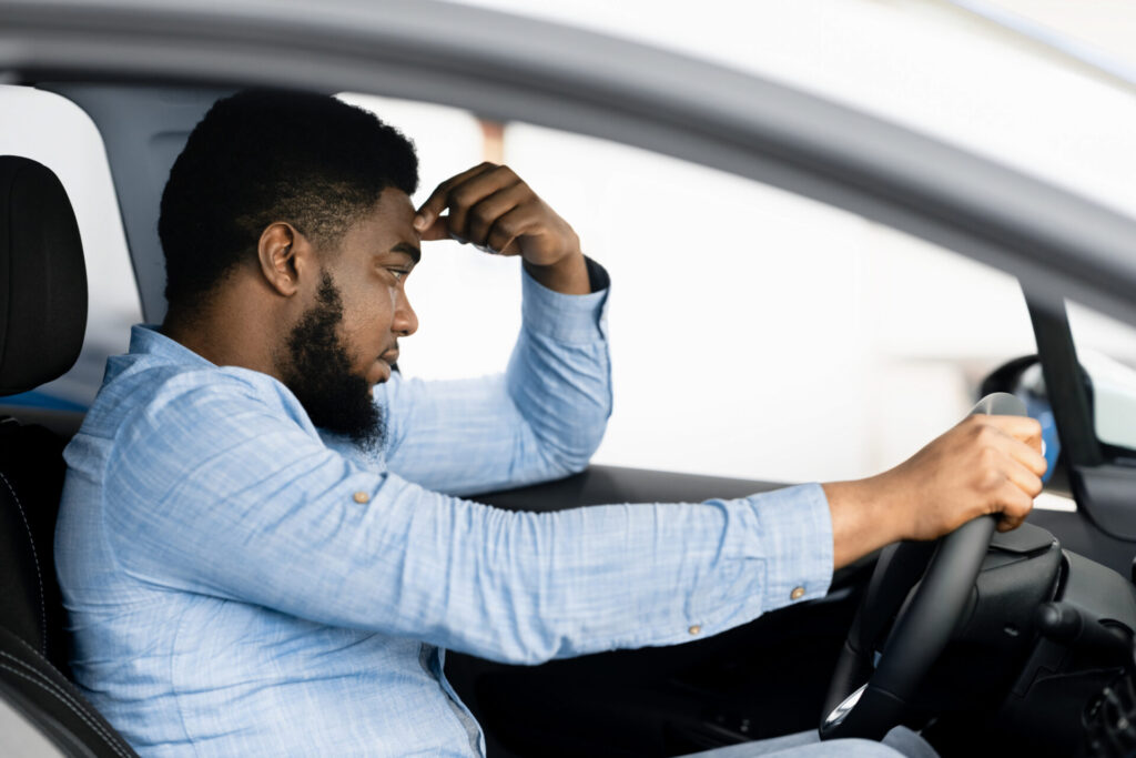 Man Sitting In Car